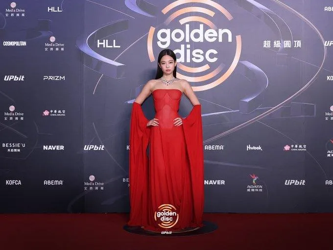 Jennie BLACKPINK red carpet 2026 Golden Disc Awards strapless corset gown dramatic sleeves diamond necklace