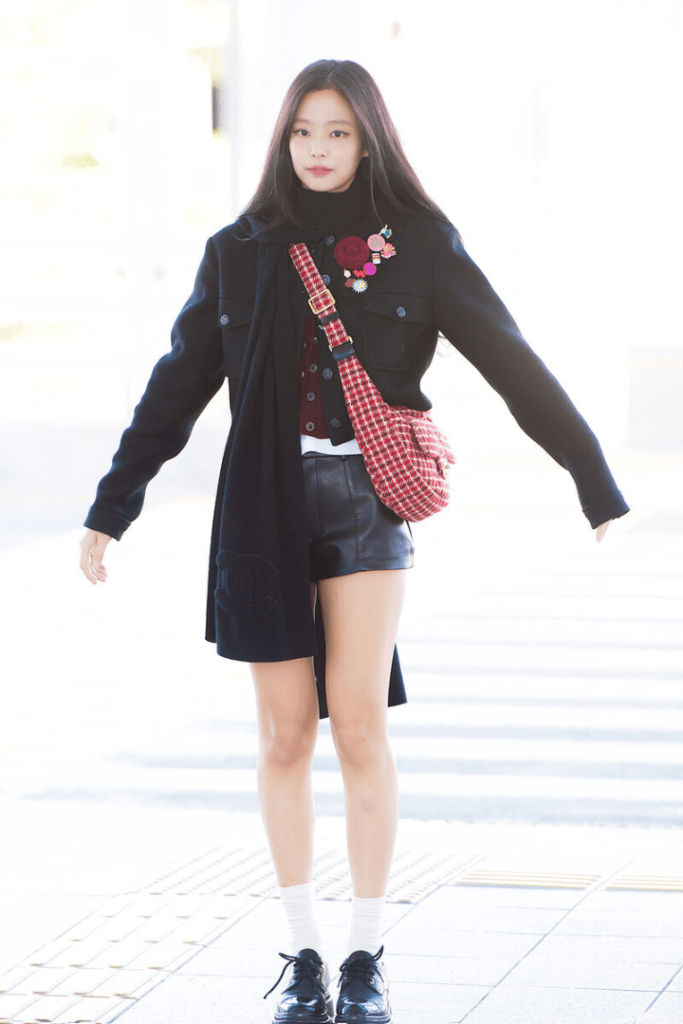 Jennie BLACKPINK 2025 airport style: Double denim trend and luxury crossbody bag.