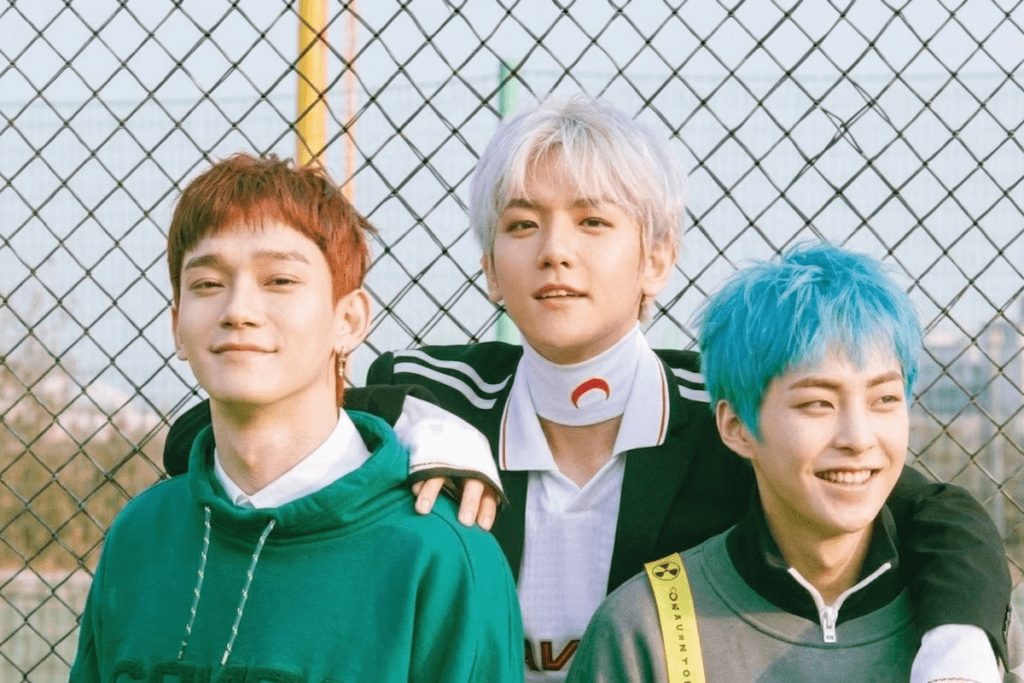 EXO-CBX members Chen, Xiumin, and Baekhyun standing together  against SM Entertainment.