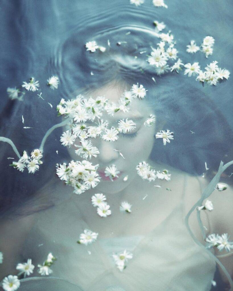 Irene Red Velvet Like a Flower solo debut poster featuring Irene submerged in water with a dark siren aesthetic