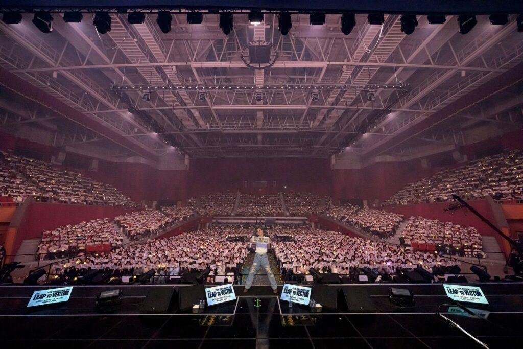 Kim Sungkyu live stage photo with crowd energy and performance lighting
