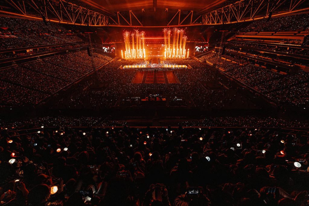 Aerial view of a sold-out, massive crowd at Kai Tak Stadium during SEVENTEEN’s record-breaking world tour performance