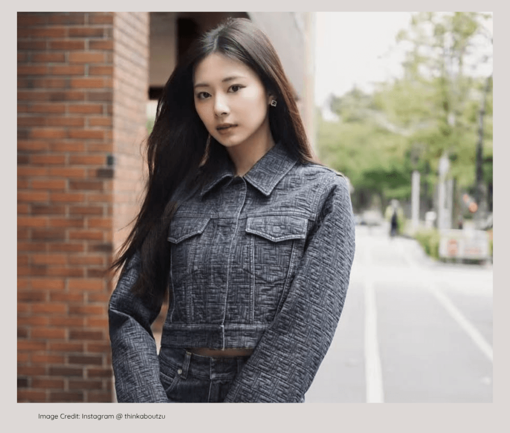 TWICE Tzuyu smiling elegantly, from a wealthy entrepreneurial family.