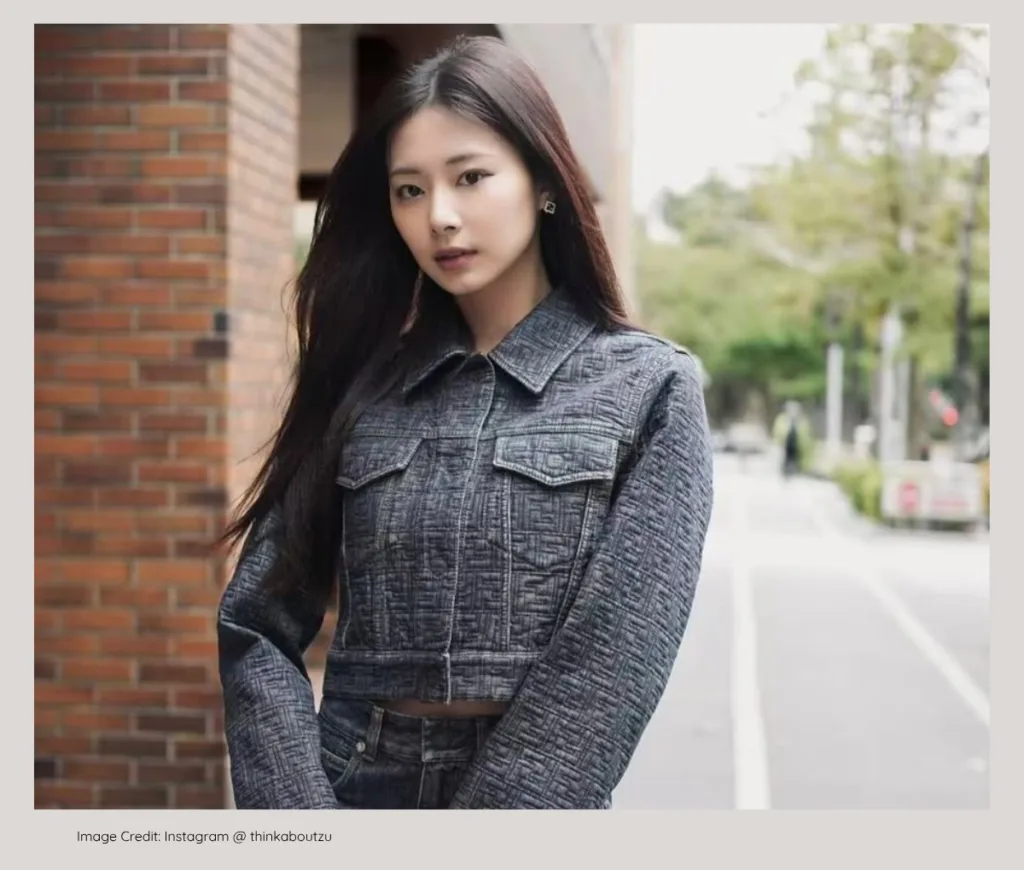TWICE Tzuyu smiling elegantly, from a wealthy entrepreneurial family.