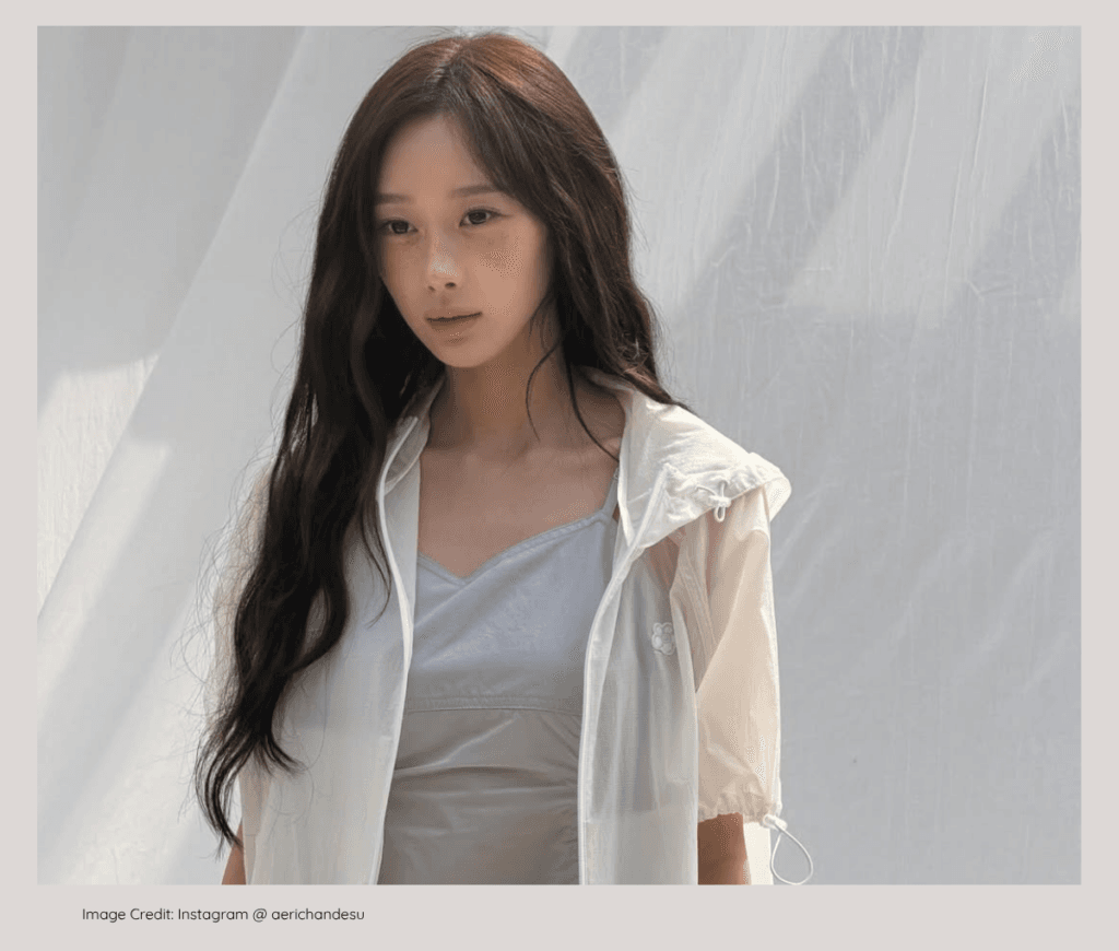 aespa Giselle posing elegantly, born into a wealthy, prominent family background