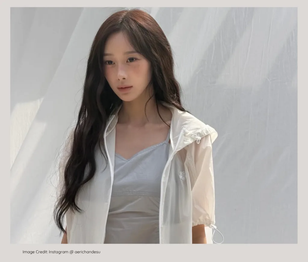 aespa Giselle posing elegantly, born into a wealthy, prominent family background