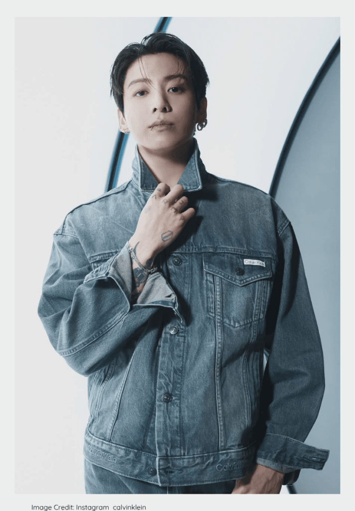 Jungkook of BTS looking sharp at a 2026 music award red carpet.