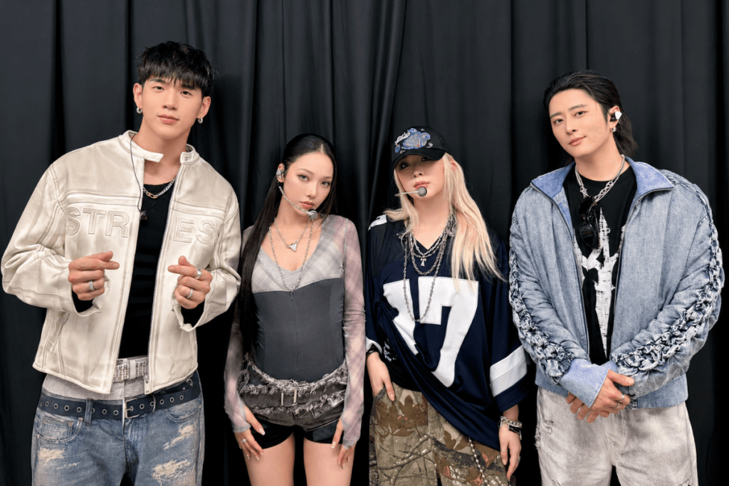 KARD members BM, J.Seph, Somin, and Jiwoo performing on stage